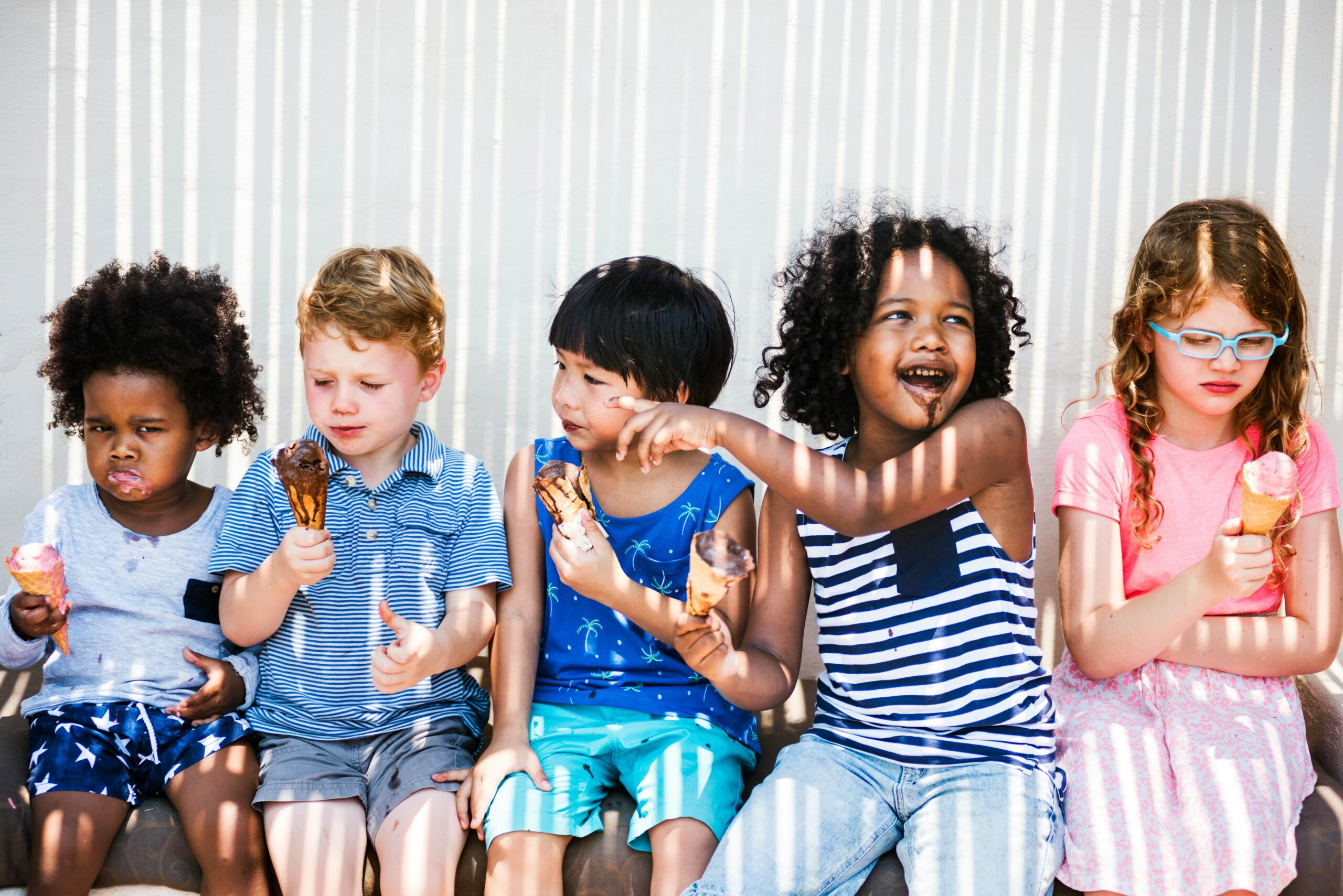 Kids eating ice cream in the summer
